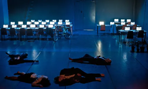 actors lying on the floor, scene image