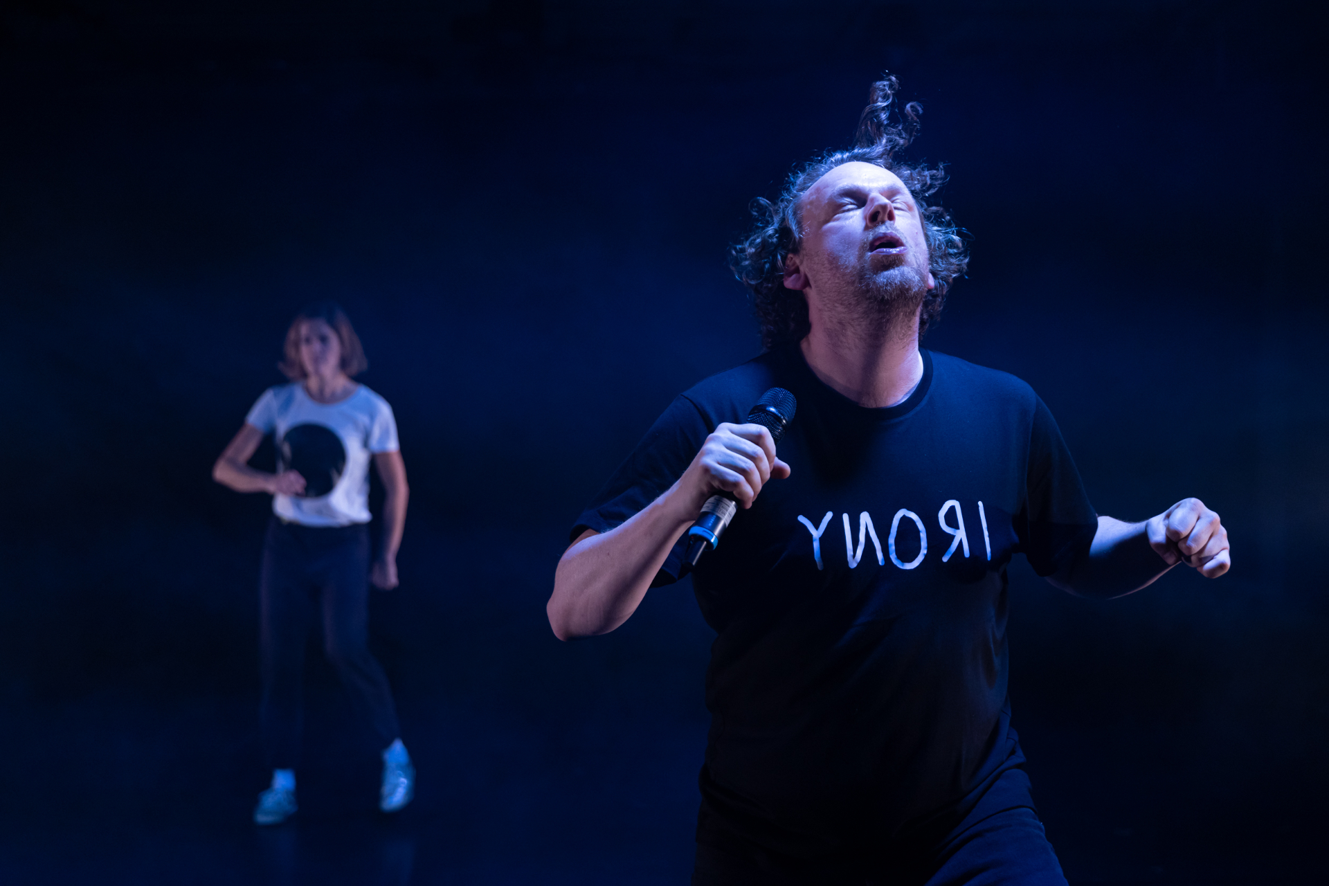 scene image of Oh Man! … 2 actors in a dark room